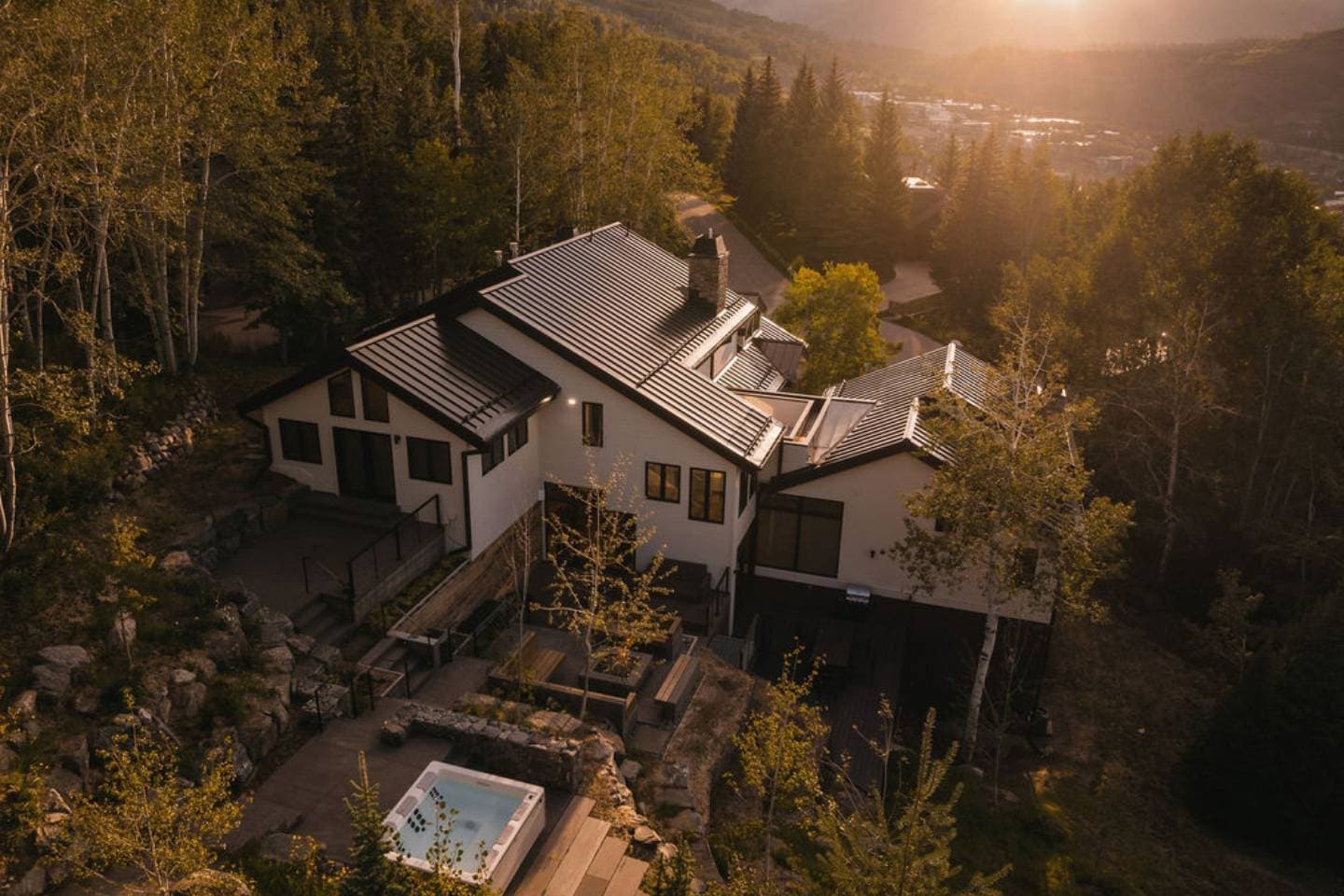 A mountain home among aspens in the Roaring Fork Valley at golden hour